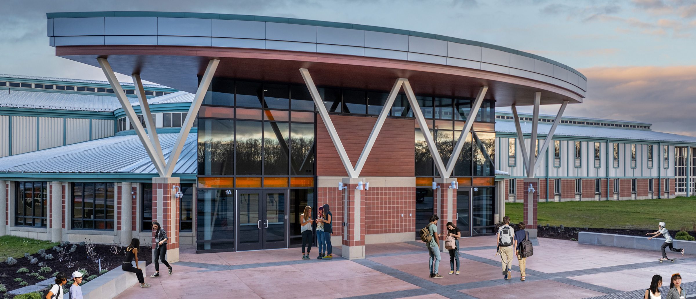 Warsaw Community High School remodeled entrance with students walking in and out