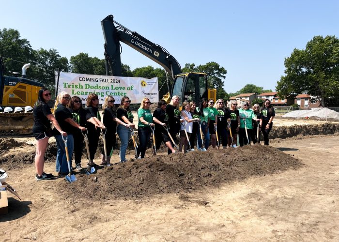 Griffith Public Schools' staff with shovels, ceremoniously breaking ground on new project