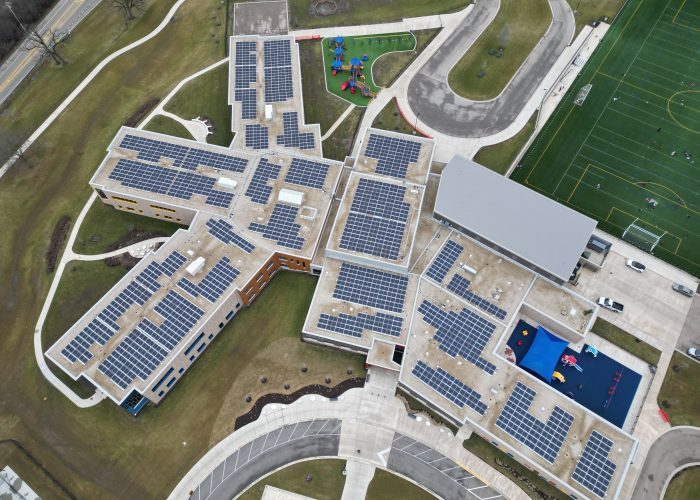 Aerial of 511 kW roof-mounted solar array at May Whitney Elementary School