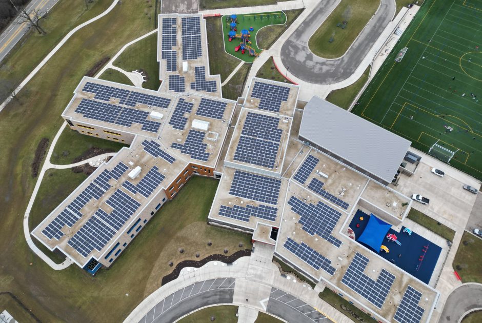 Aerial of 511 kW roof-mounted solar array at May Whitney Elementary School