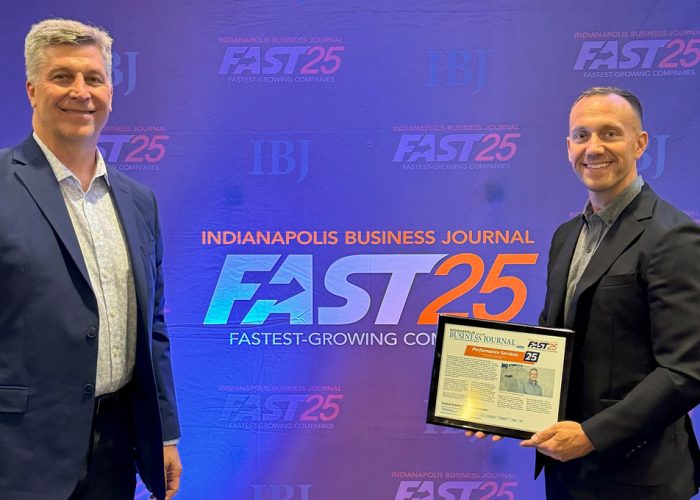 Performance Services Employees Holding IBJ's Fast25 Award to honor fastest-growing companies in Central Indiana