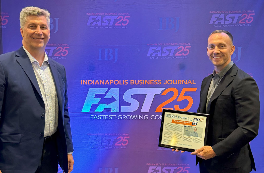 Performance Services Employees Holding IBJ's Fast25 Award to honor fastest-growing companies in Central Indiana