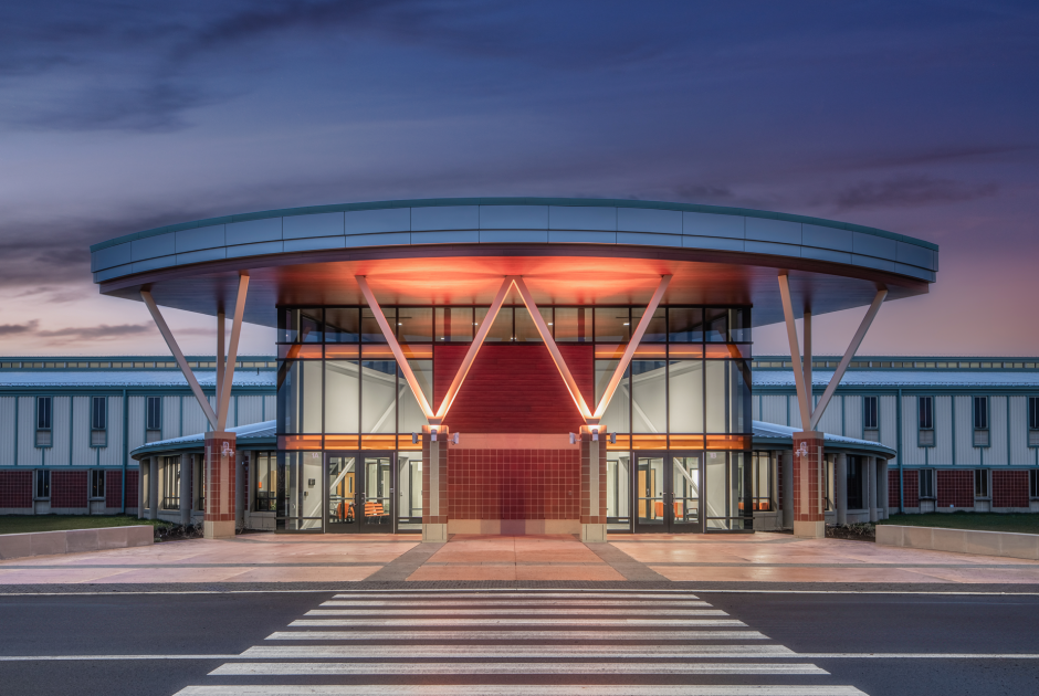 Exterior of new Warsaw High School entrance at night