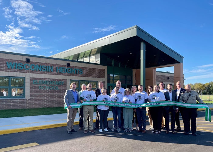 Wisconsin Heights project team celebrating successful completion of project with ribbon cutting ceremony