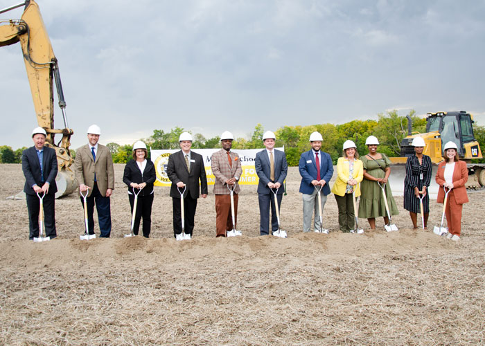 Avon Community Schools Project Team at project groundbreaking ceremony with hard hats and shovels