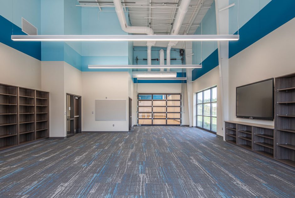 Charter School of the Dunes new media center without furniture and empty bookshelves